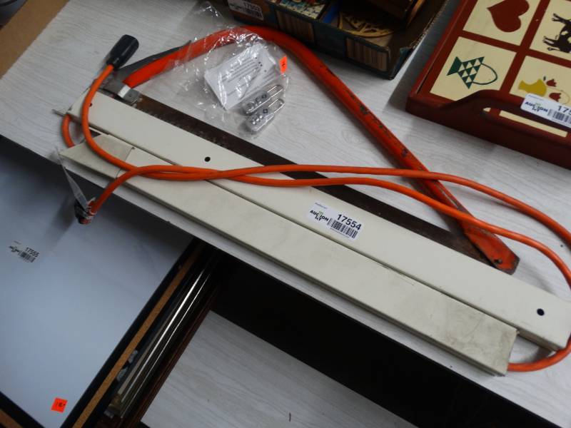 lot 17554 image: Lot of extension cord, handsaw, & metal brakets.