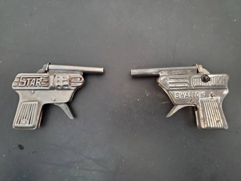lot 13659 image: Two Star Swallow Toy Guns