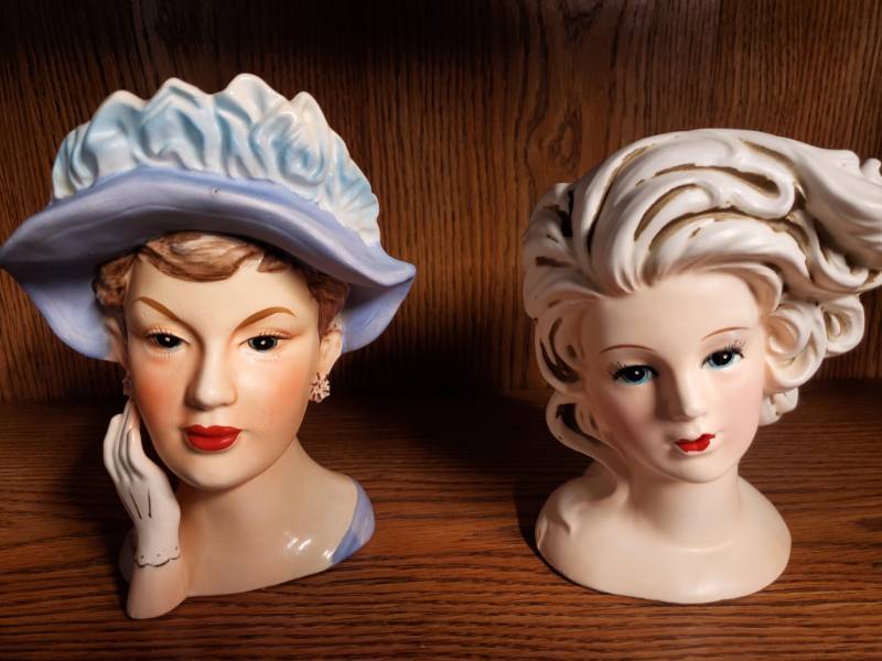 lot 13772 image: Two Lady Head Vases - Blue Hat & Hair Blowing