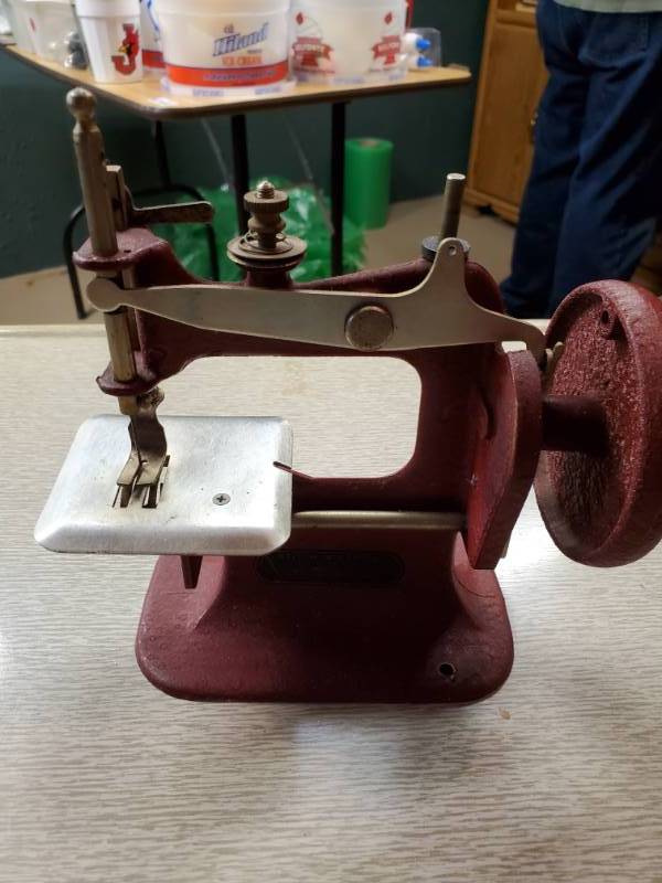 lot 13802 image: Vintage Red Stitch Mistress Sewing Machine - A Genero Toy