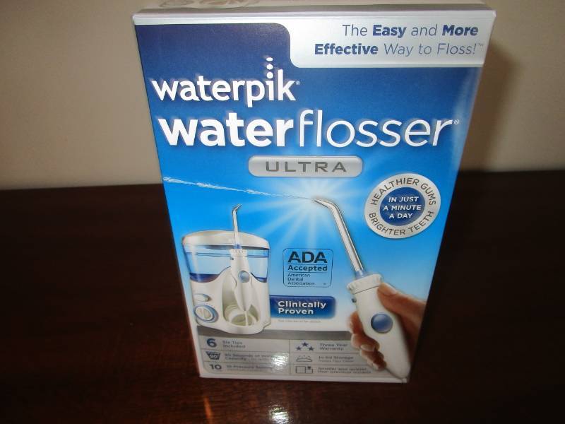 lot 13691 image: Waterpik Water Flosser in Box