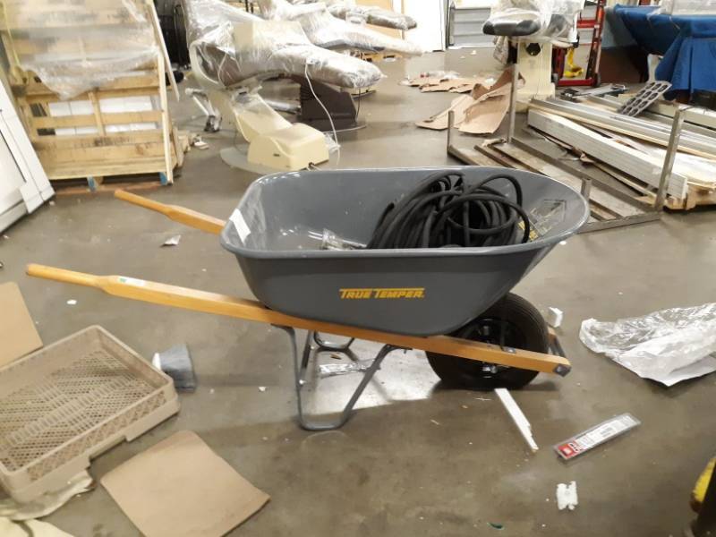 lot 6967 image: Wheel barrel w hose.