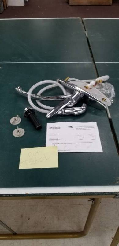 lot 6096 image: Delta Single Handle Kitchen Faucet w Sprayer Appears New No Further Testing