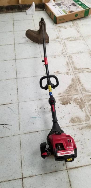 lot 2310 image: Troy-Bilt Weed Eater Has Compression No Further Testing