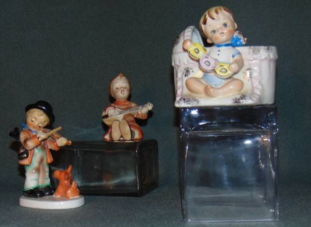 lot 10008 image: Samson Improt, Co. Baby in Bassinet Figurine, GoldCastle Japan Figurines (2)