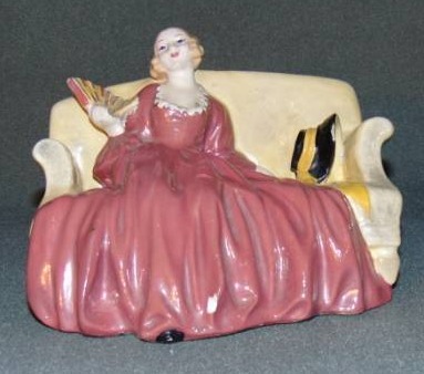 lot 10009 image: Vintage Ceramic Victorian Lady on Couch