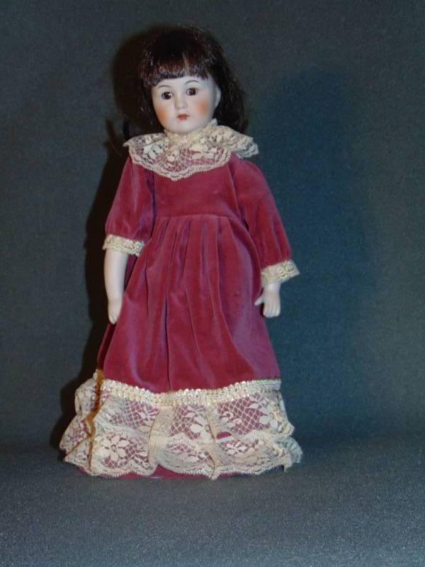 lot 10011 image: Vintage Porcelain Doll with Stand