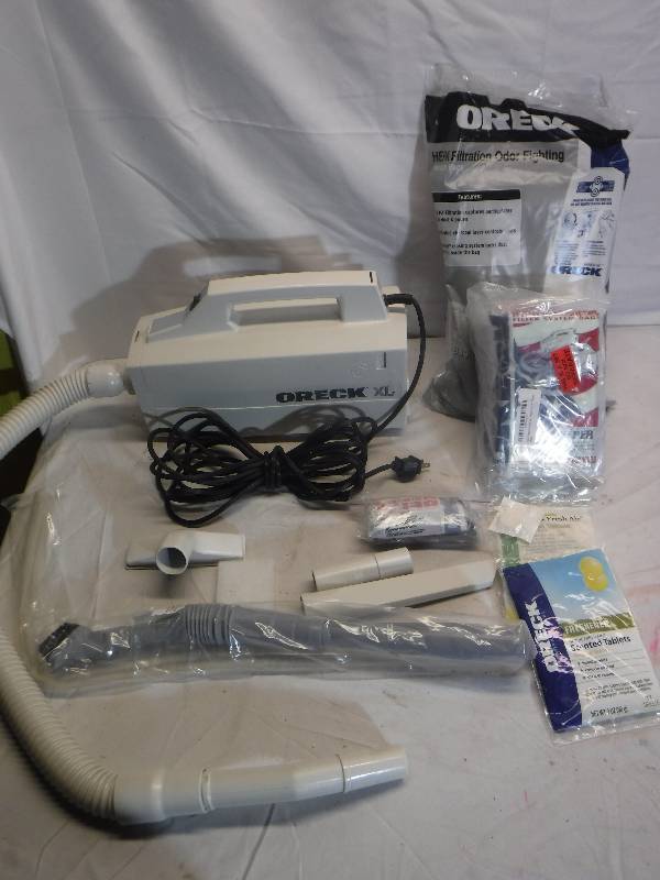 lot 12096 image: Oreck XL canister vacuum with bags and accessories