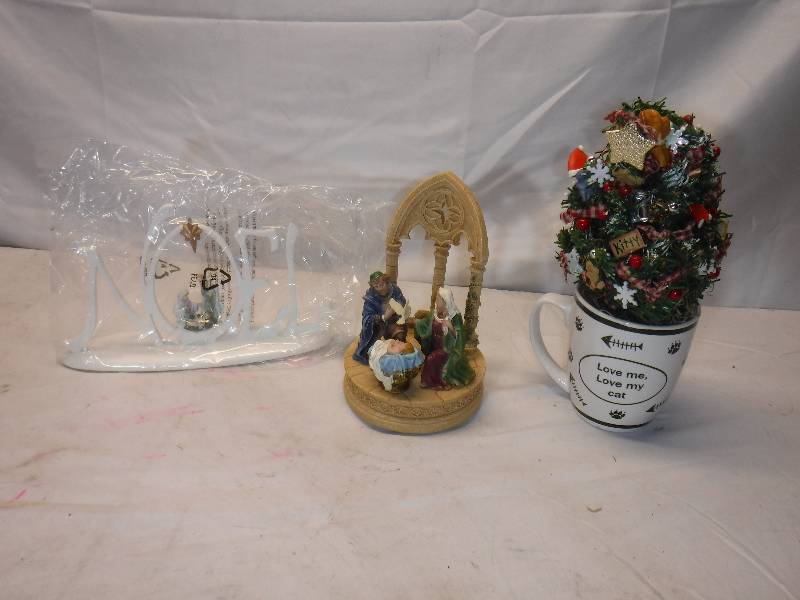 lot 12086 image: Christmas lot includes mini tree in a mug