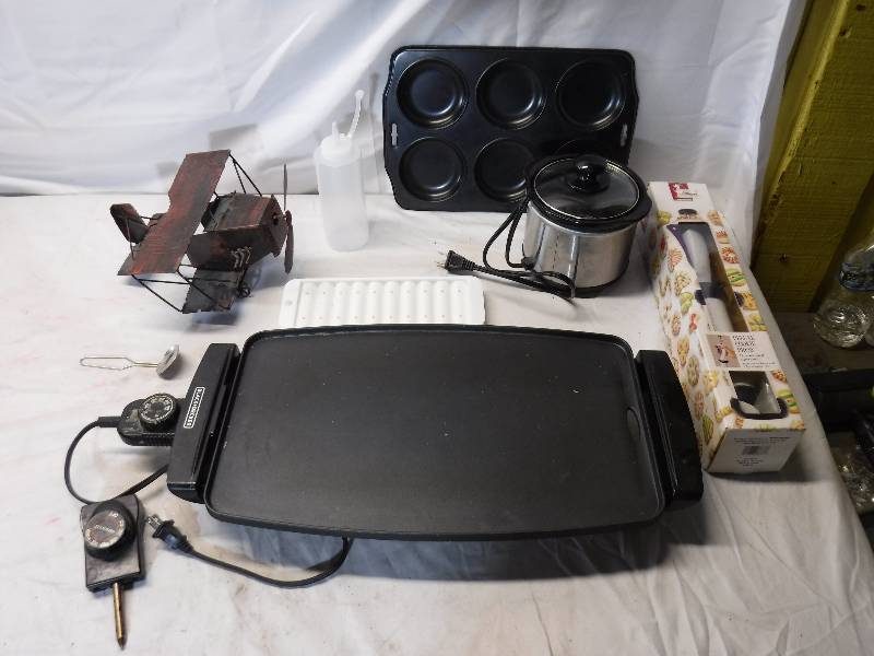 lot 12105 image: Metal plane model, electric griddle, crock pot and more