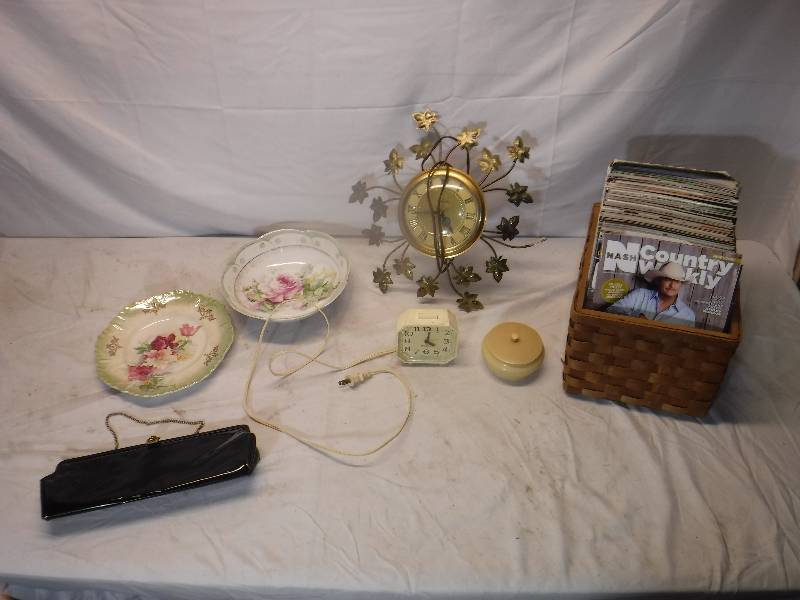 lot 12205 image: Clocks, dishes, wicker basket with magazines and more