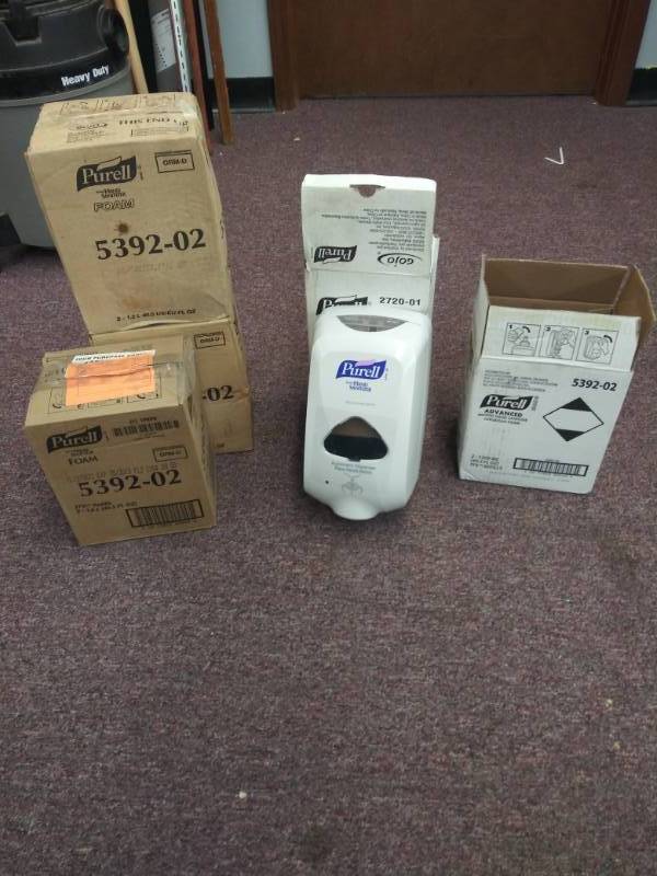 lot 1347 image: Bundle of Purell Sanitizing Solution and Dispensers