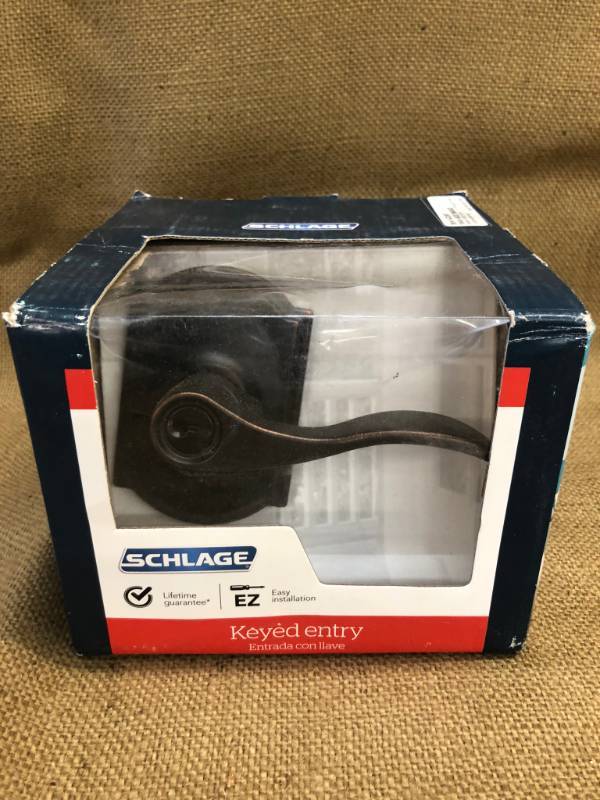 lot 1440 image: Schlage Aged Bronze Key Entry Doorway Knob - Original Packaging