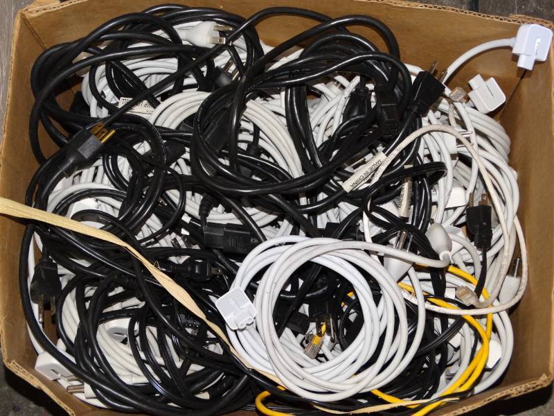 lot 16011 image: Box full of power cords.