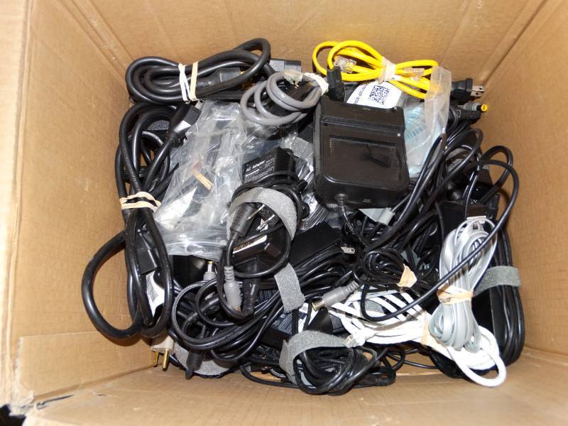 lot 16025 image: Box of Computer cords and laptop chargers.