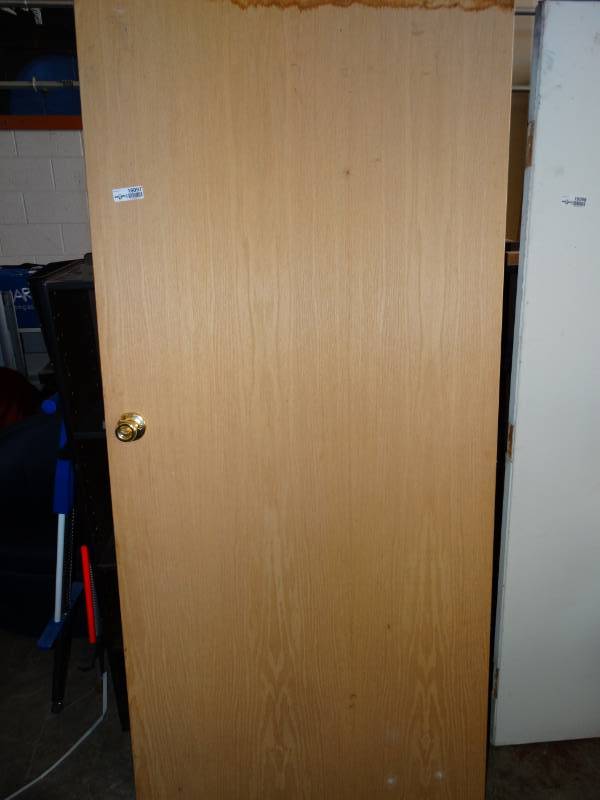 lot 16097 image: Wooden door with handle.