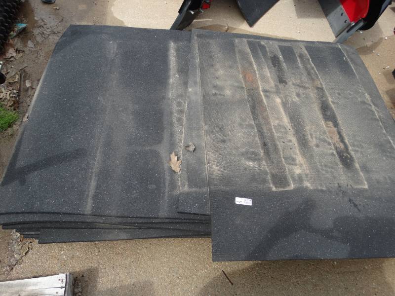 lot 16138 image: Large lot of rubber mats, most have holes or are cut.