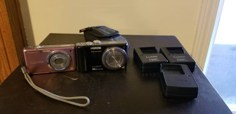 lot 5037 image: Panasonic Lumix Cameras with Carry Bag and Battery Chargers Black Camera Has a Battery