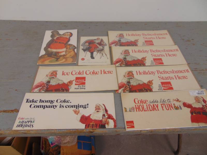 lot 7120 image: 7 Vintage Coca-Cola Advertisement Pieces