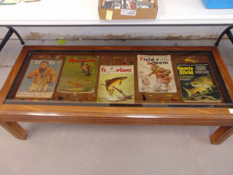 lot 7134 image: Coffee Table - Vintage Magazines and Fishing Lures inlaid