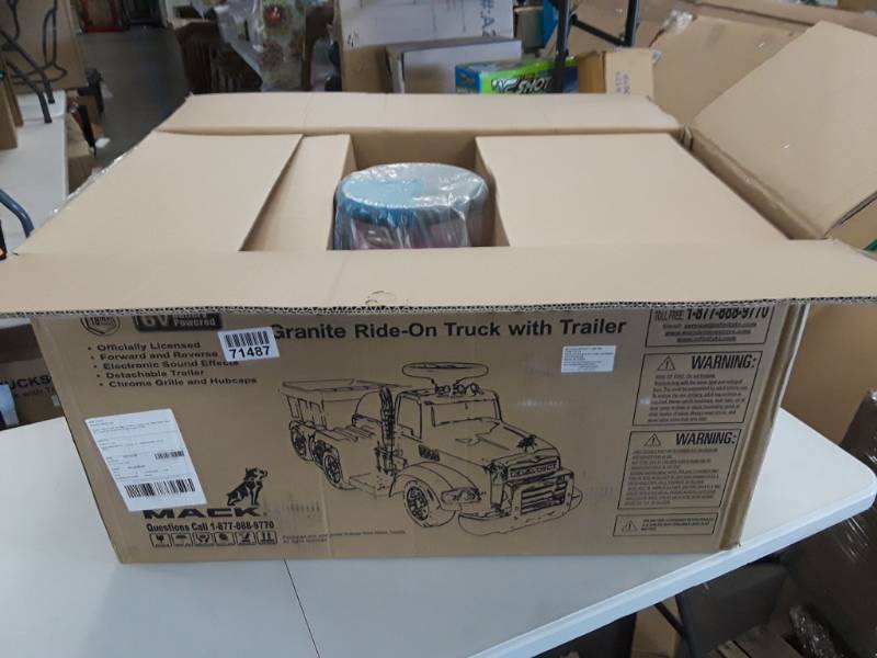 lot 8218 image: Wonderlanes Mack Trucks Granite Ride-On Truck with Trailer