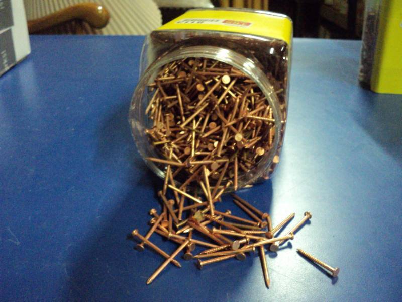 lot 8113 image: 6.5 lbs copper colored finish nails, approx 1-12 long