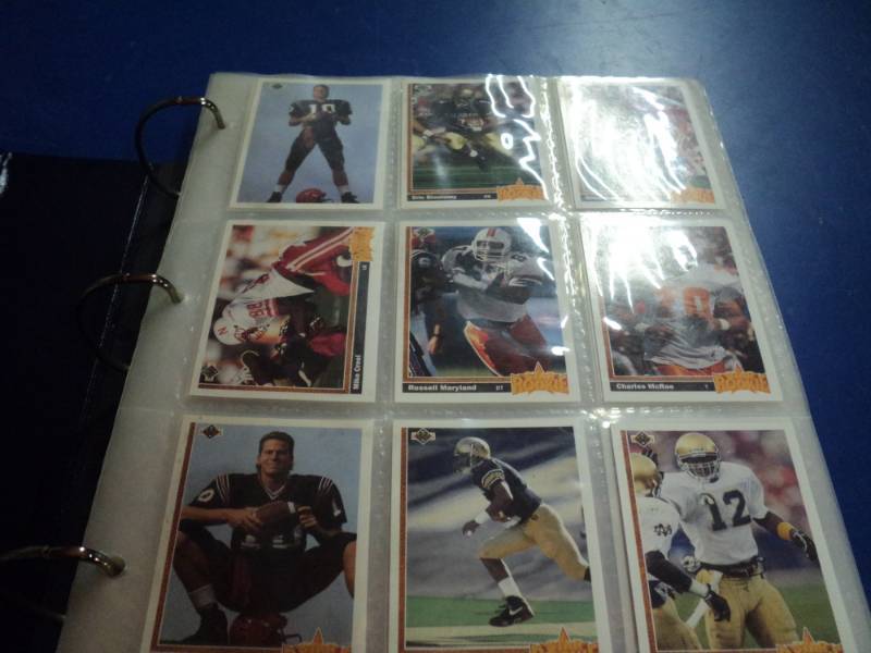 lot 8190 image: Binder Football Cards 1991, Favre-Rookie, Derrick Thomas, Jerry Ricce, Steve Young, John Elway, 77 pages