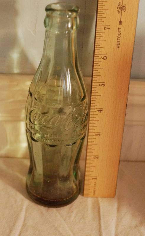 lot 1412 image: Embossed COKE BOTTLE - Two Towel rings-New -Books- New Old Navy Fluff Ball keyring