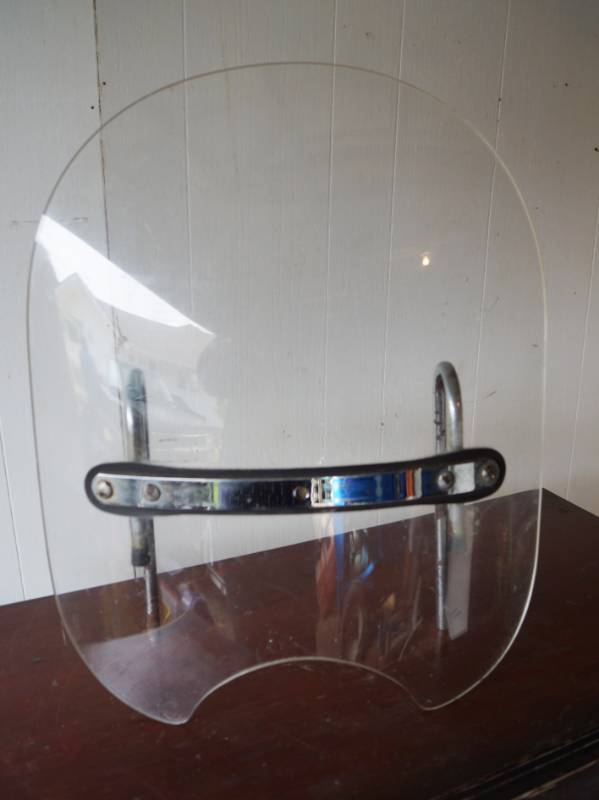 lot 1484 image: Motorcycle windshield -See pics for size and condition.