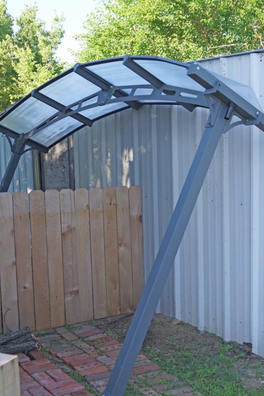 lot 1507 image: Palram Arcadia awning-See pics for dimensions-new-one piece of Lexan is bent