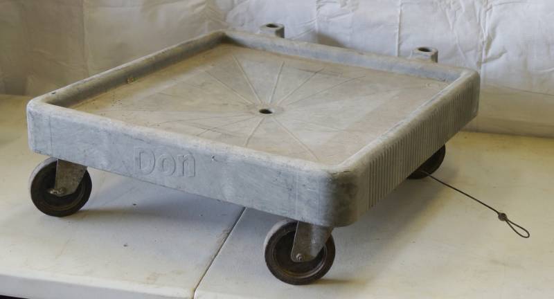 lot 5391 image: Don - 4 Wheeled Dolly w hanging strap & drain hole 23 x 23