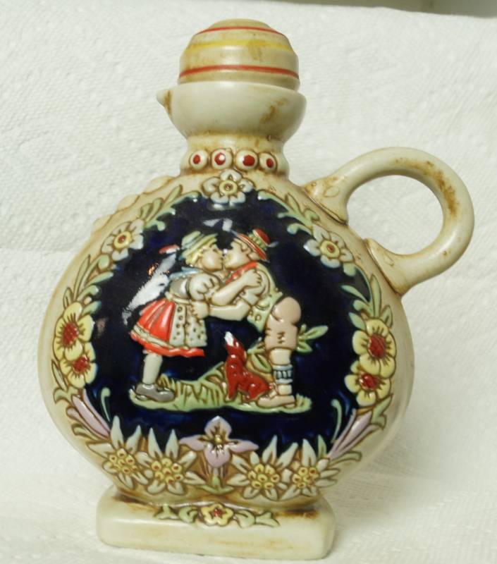 lot 1071 image: Ceramarte Decanter - Dutch Couple Kissing and Floral Made in Brazil - Perfect Condition