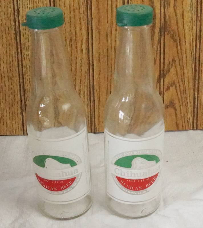 lot 1445 image: Set of Chihuahua Mexican Beer Salt and Pepper Shakers