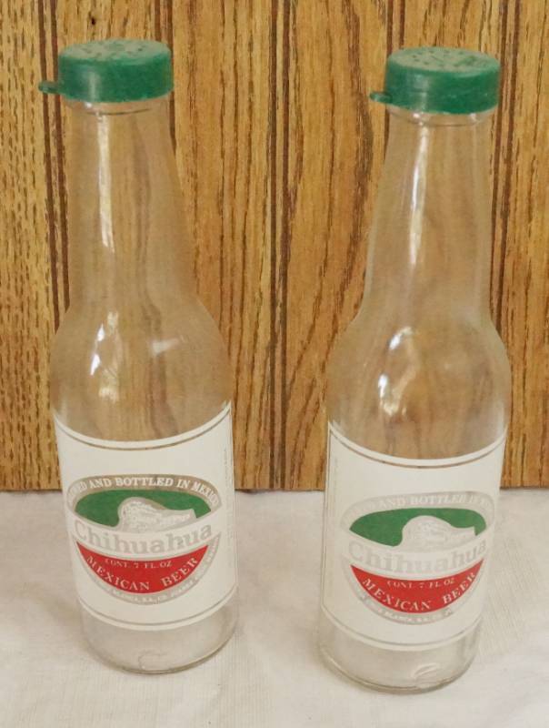 lot 1446 image: Set of Chihuahua Mexican Beer Salt and Pepper Shakers