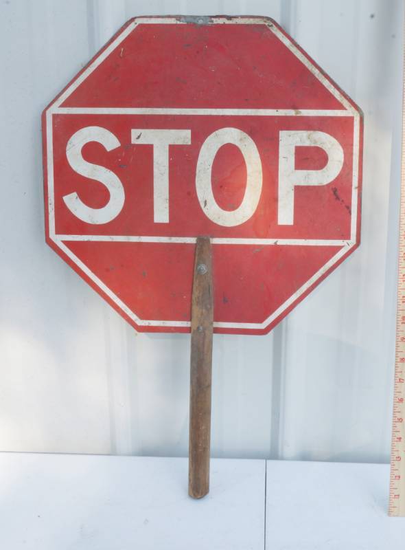 lot 1033 image: Vintage Traffic Man Sign - Small Holding Stop Sign - One Side Stop and One Side Slow