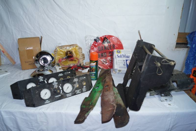 lot 1634 image: Lot of Misc. Garage Items - Gauges, John Deere Hub Caps, and More