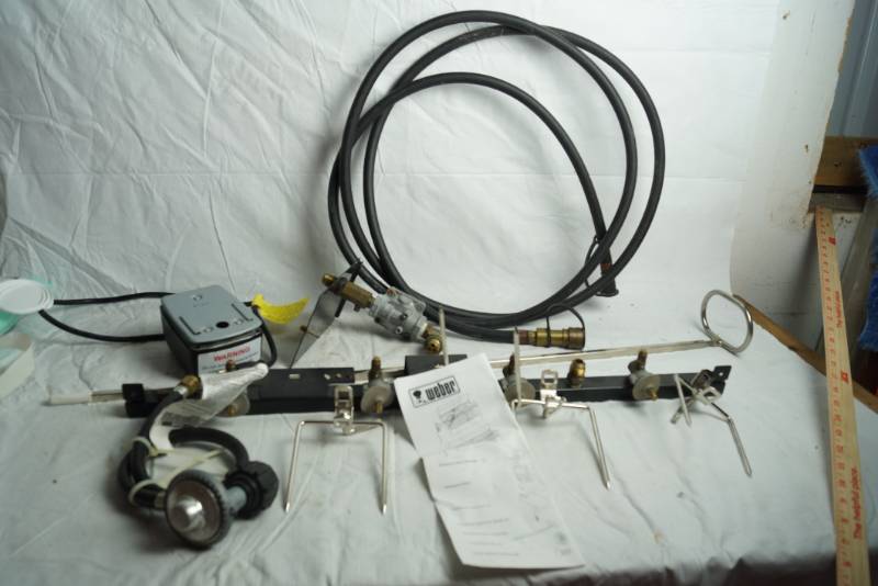 lot 1699 image: Weber Grill Rotisserie System wManual - NEW IN ORIGINAL BOX UNUSED