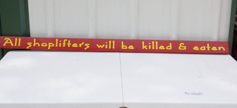 lot 1468 image: All Shoplifters Will Be Killed & Eaten Wooden Sign