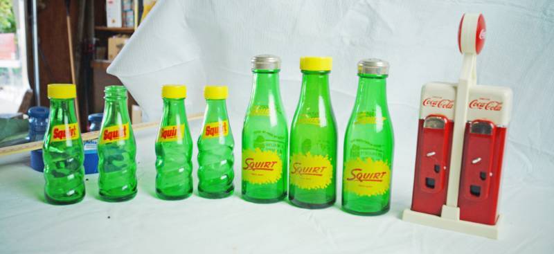 lot 1257 image: Vintage Salt and Pepper Shakers - COCA-COLA (3pc set) and SQUIRT - AWESOME