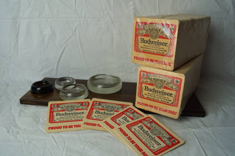 lot 1358 image: Vintage UNUSED BUDWEISER BEER BAR COASTERS - New In Packages And Glass Chair Levelers