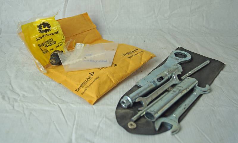 lot 1361 image: John Deere Parts and a Tool Kit
