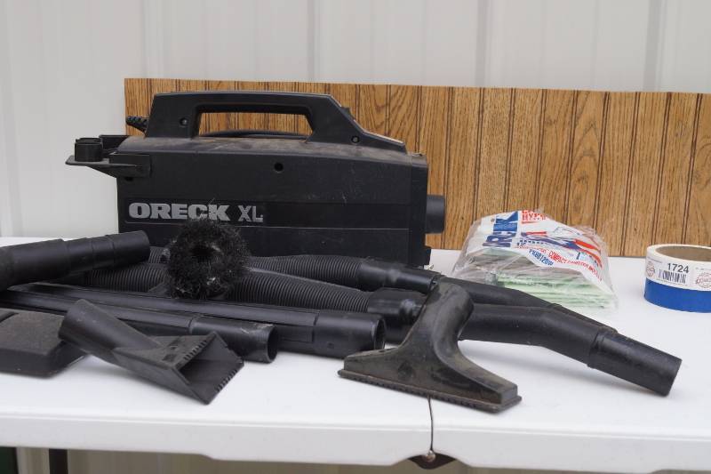 lot 1722 image: Oreck XL Portable Vacuum Cleaner - With Lots of Attachments