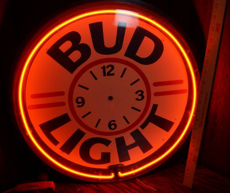 lot 1932 image: NEON - Bud Light Wall Clock - Hands are missing and clear cover has a chip see pics