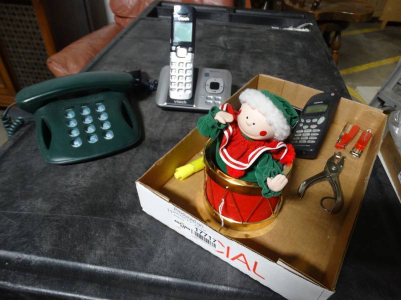 lot 17717 image: Lot of phones, hole punch, & christmas decor.