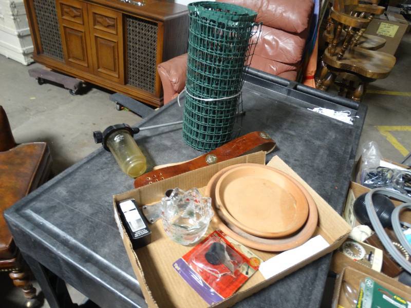 lot 17728 image: Flower pot plates, green snow, glass decor, & more.