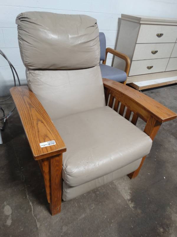 lot 17803 image: Recliner chair with wooden base.
