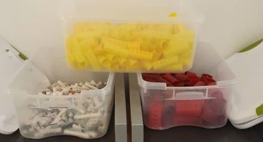 lot 1061 image: Three Totes - One Perm Rods, Two Plastic Rollers