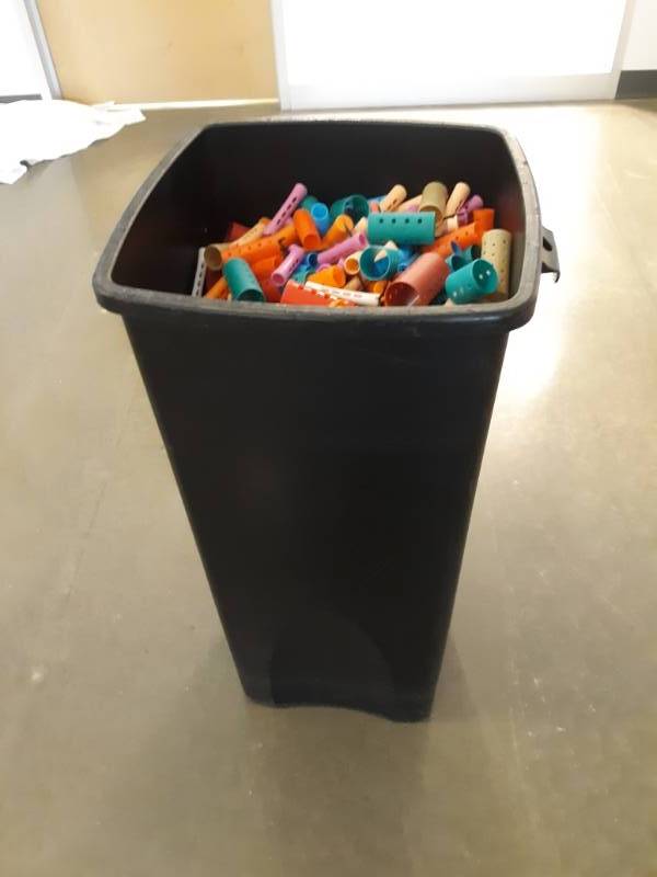lot 1064 image: Trash Recepticle Full of Misc Perm Rods and Plastic Rollers
