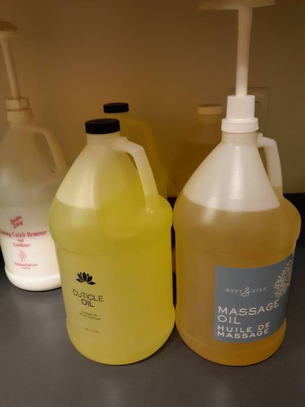 lot 1116 image: Massage Oil, Cuticle Oil Gallon Jugs Lot