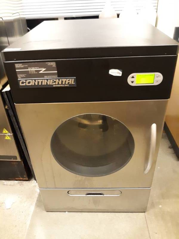 lot 1099 image: Continental Commercial Front Load Electric Dryer with Under Drawer Powers on Fully Functioning